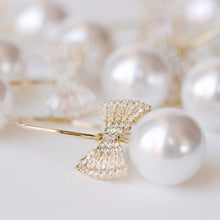 Load image into Gallery viewer, Bow Tie Pearl Holiday Statement Earrings
